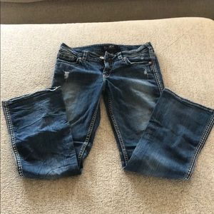 Distressed bootcut silver jeans